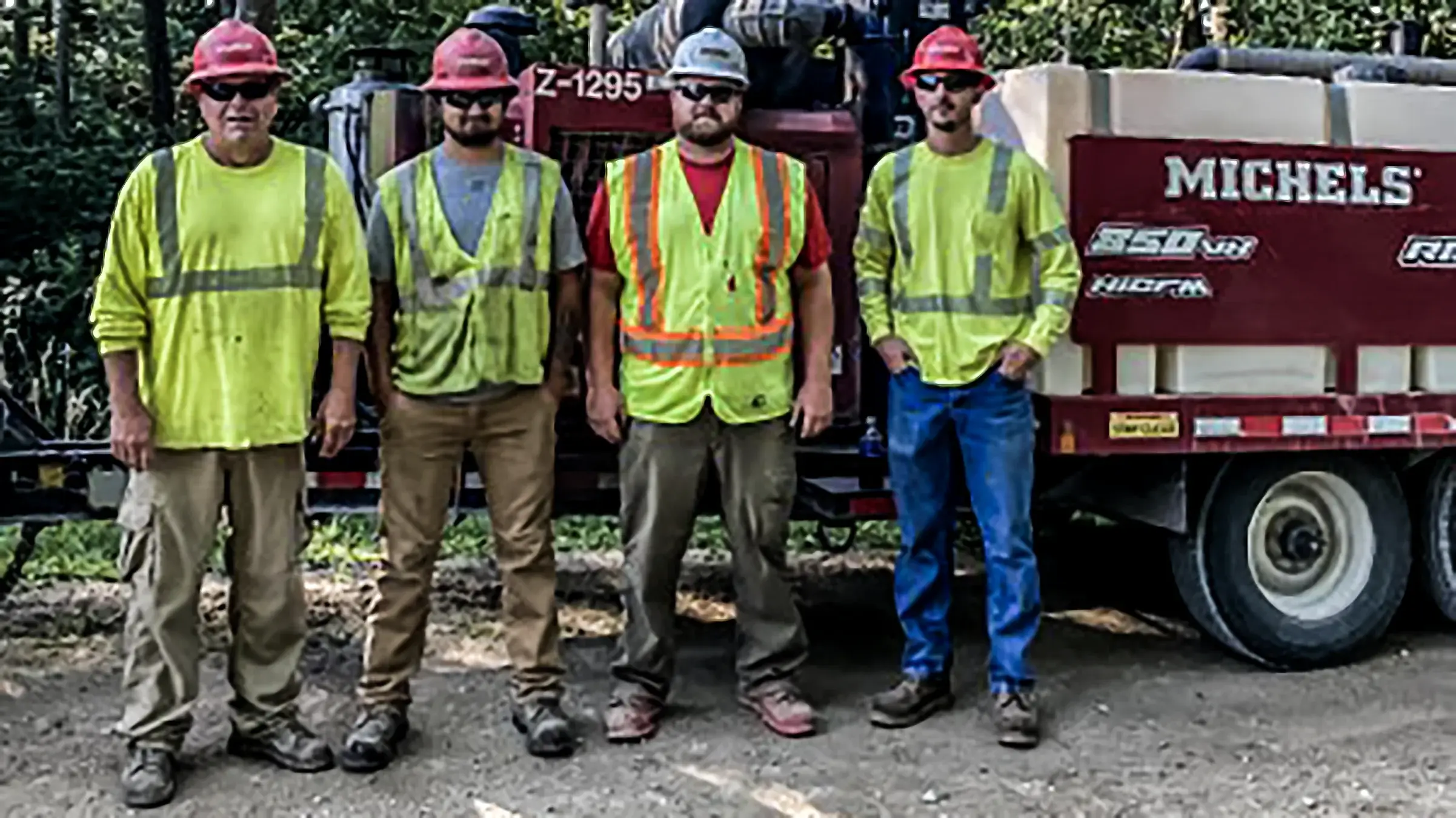 Four Michels crew members stand together