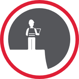 A person standing on a plateau overlooking a jobsite.