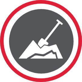 A shovel mounted into a pile of dirt.