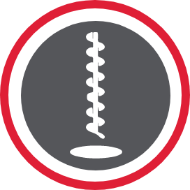 A rotating drill piece drilling into a hole.