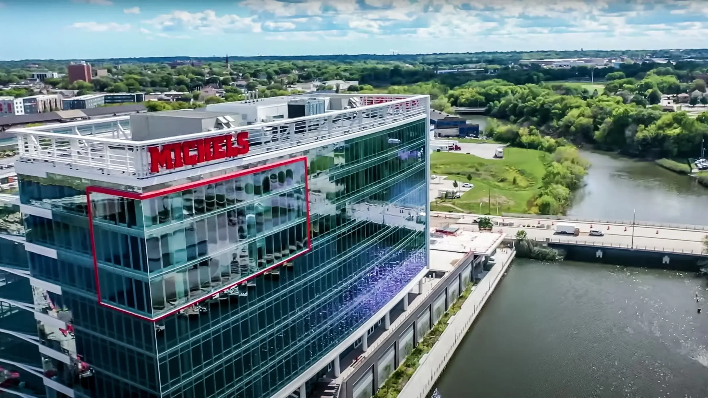 R1VER Milwaukee office building near a river.