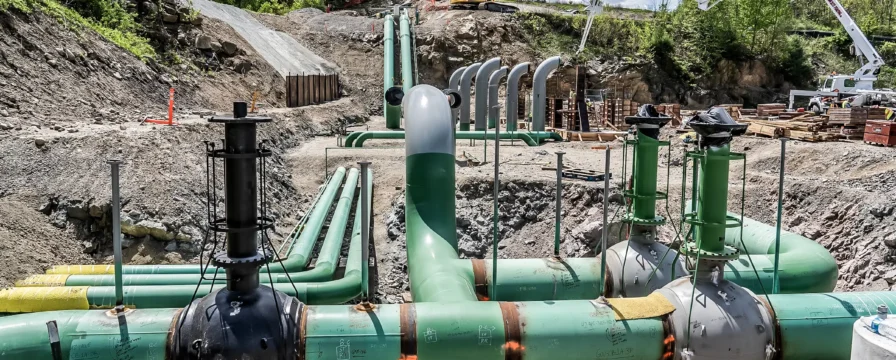 Compressor station facility pipelines in an abandoned quarry.