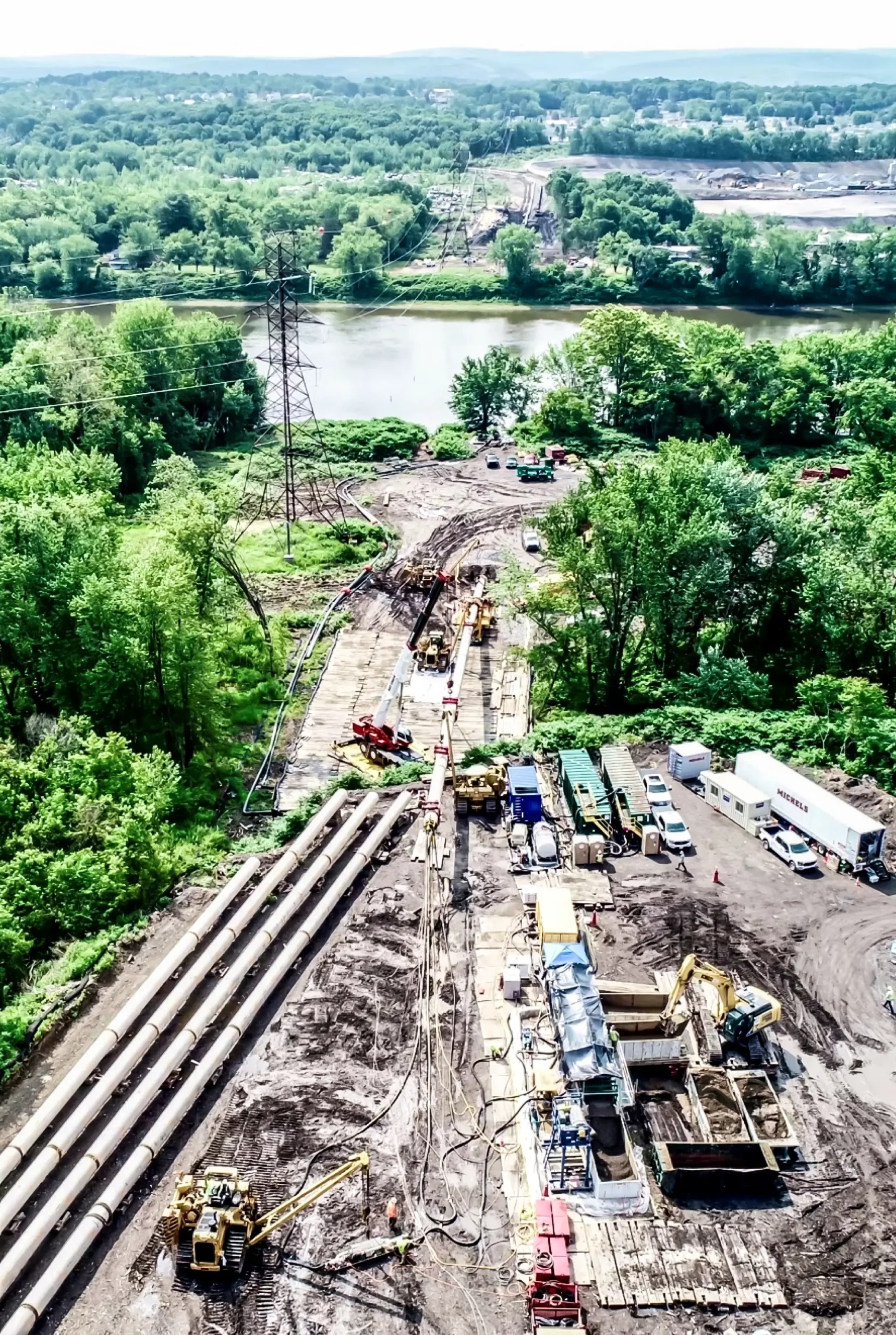 A large scale pipeline project near a riverside.